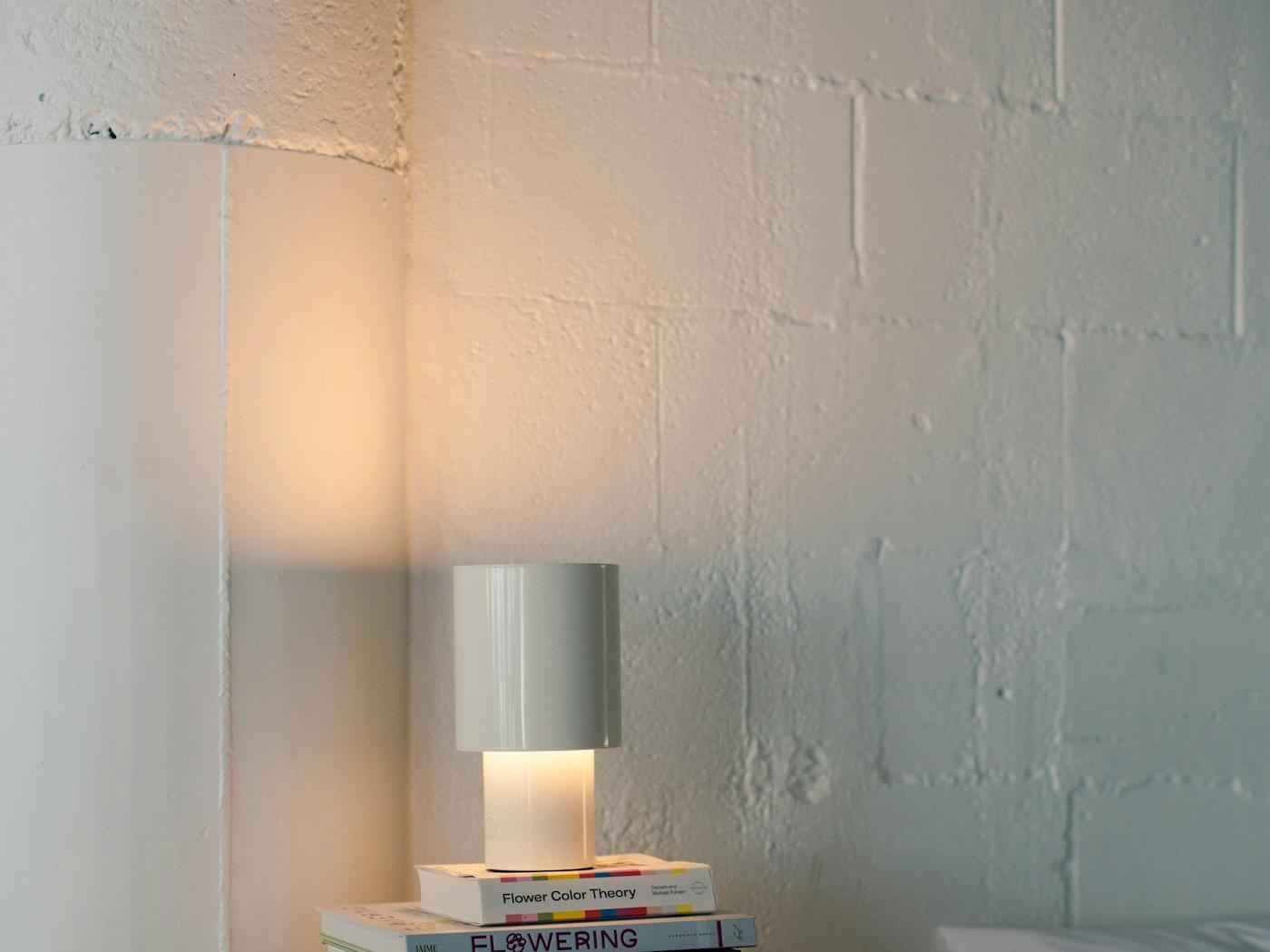 Solis Ambient LED Smart Light glowing warm amber on a side table