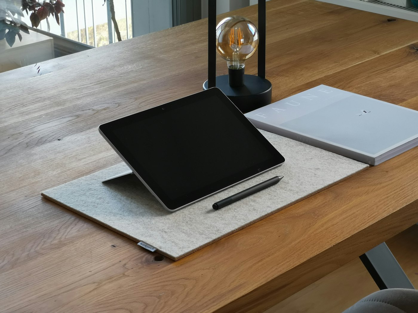 Solis Minimalist Desk Mat and Organizer on a light wood desk