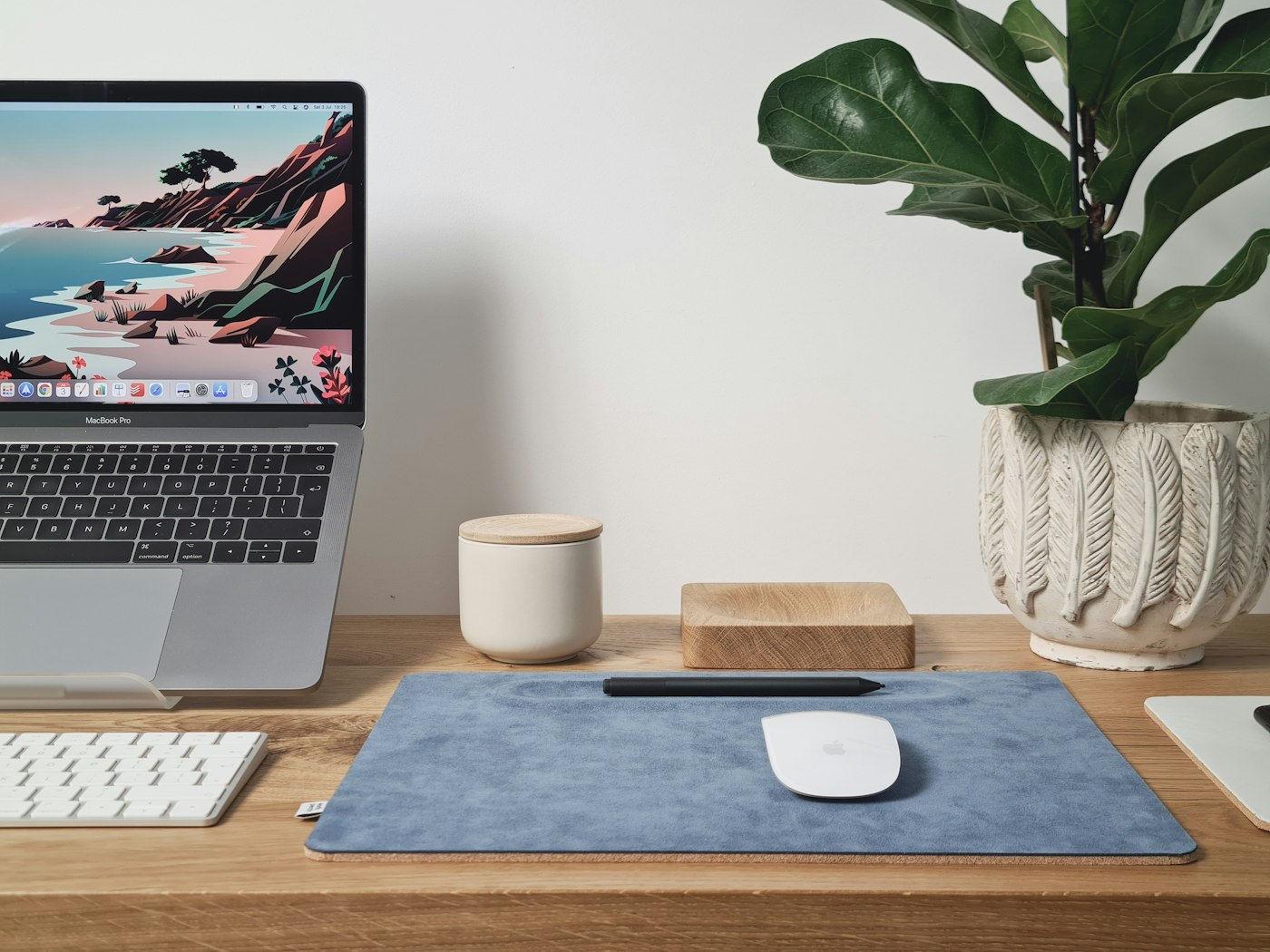 A curated arrangement of Solis Goods everyday essentials on a warm oak desk